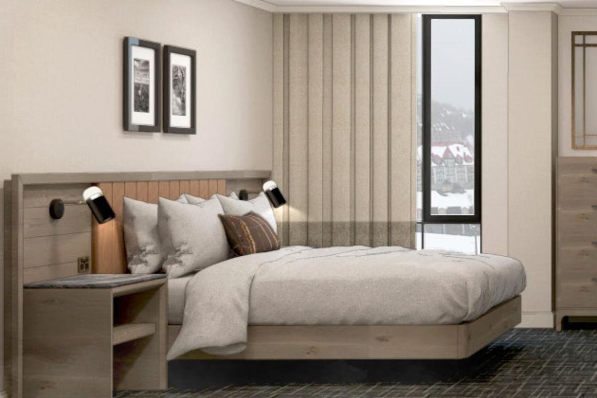 Fairmont Tremblant Hotel Buitenkant foto A bedroom at the 2019-opened Hilton Garden Inn in Lake Placid, New York